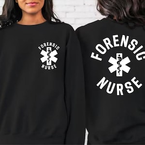 May include: Black sweatshirt with white text that reads "Forensic Nurse" and a white medical symbol with a snake inside.
