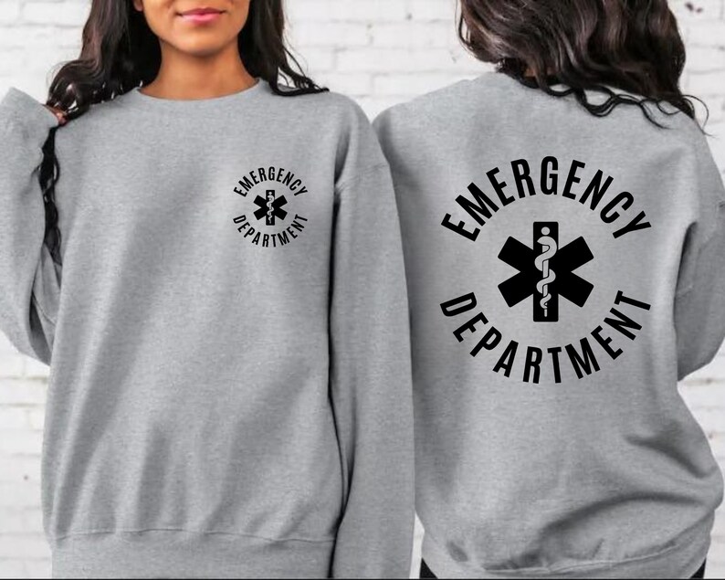 May include: Gray sweatshirt with the text "EMERGENCY DEPARTMENT" and a medical symbol on the back. The same text and symbol are on the front in a smaller size.