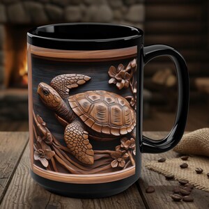 May include: Black ceramic mug featuring a detailed relief of a turtle with floral accents. The turtle is a warm brown color, set against a dark background. The mug has a black handle and rim, perfect for coffee or tea.