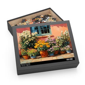 May include: A 120-piece jigsaw puzzle featuring a colorful painting of a brick wall with a window and a row of potted flowers in front of it. The puzzle box is open, showing the puzzle pieces inside.