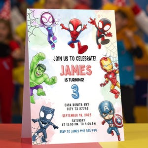 May include: A colorful birthday party invitation featuring various superhero characters. The invitation includes the text "JOIN US TO CELEBRATE! JAMES IS TURNING 3" along with event details. The design incorporates a watercolor effect and superhero illustrations.