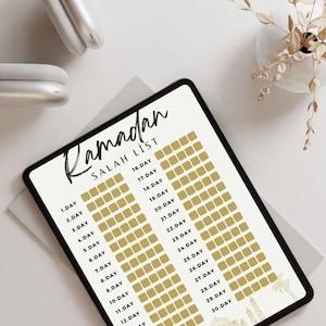 May include: A digital tablet with a white background and black text. The text reads "Ramadan Salah List" and lists the days of Ramadan from 1 to 30. Each day has a corresponding gold square to check off.