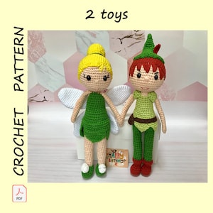 May include: Crochet pattern for two toys: a green fairy with white wings and a green Peter Pan with a red hat. The toys are holding hands and are standing on a white box with a "Happy Birthday" sign.