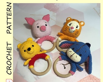 May include: Four crocheted stuffed animal toys with wooden rings. The toys are Piglet, Winnie the Pooh, Tigger, and Eeyore.