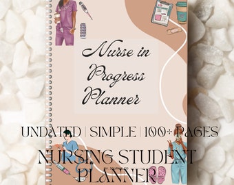 May include: A spiral-bound planner with the title "Nurse in Progress Planner" and "Nursing Student Planner" in elegant script. The cover features illustrations of medical tools and a nurse. The text reads "UNDATED | SIMPLE | 100+ PAGES".