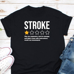 May include: Black t-shirt with white text that reads "STROKE" and a one-star rating. The text below the rating reads "Way too expensive, hard to manage, and didn't come with instructions. Would not recommend."