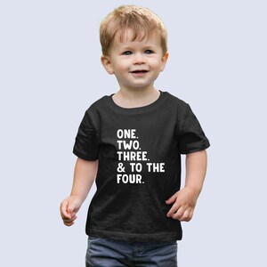May include: A black toddler t-shirt with white text that reads "ONE. TWO. THREE. & TO THE FOUR."