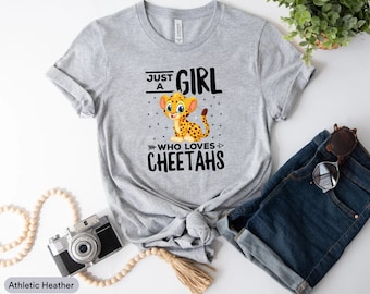 May include: Gray t-shirt with the text "Just a Girl Who Loves Cheetahs" and a cartoon cheetah illustration.