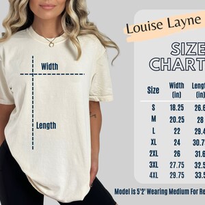 May include: Cream-colored t-shirt with a size chart. The chart lists sizes S to 4XL, with width and length measurements in inches. The text "Louise Layne LLC" is at the top right. The model is 5'2" and wearing a medium.
