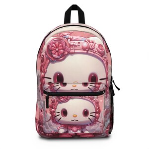 May include: Pink backpack with a cartoon character design. The character is a white cat with pink ears and a pink bow. The backpack has a black zipper and a mesh pocket on the side.