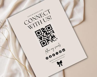 May include: A beige card with the text "CONNECT WITH US!" and a QR code. Below the QR code are social media icons and the text "follow my socials". The card also includes a website address and a bow graphic.