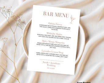 May include: A wedding bar menu card with a minimalist design. The card features a list of cocktails: Paloma Fresca, Midnight Mojito, Spicy Mango Margarita, and Lavender Lemon Drop. The names of the couple and the wedding date are also included.
