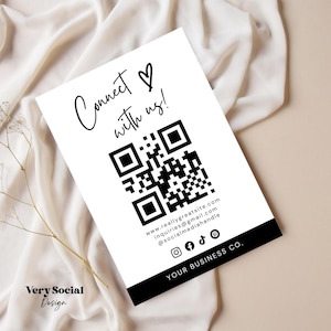 Op de afbeelding: Zwart-witte QR-code met de tekst "Connect with us!" erboven. Onder de QR-code staat het websiteadres "www.reallygreatsite.com", het e-mailadres "inquiries@gmail.com" en de social media handle "@socialmediahandle". De tekst "YOUR BUSINESS CO." staat onderaan de kaart.