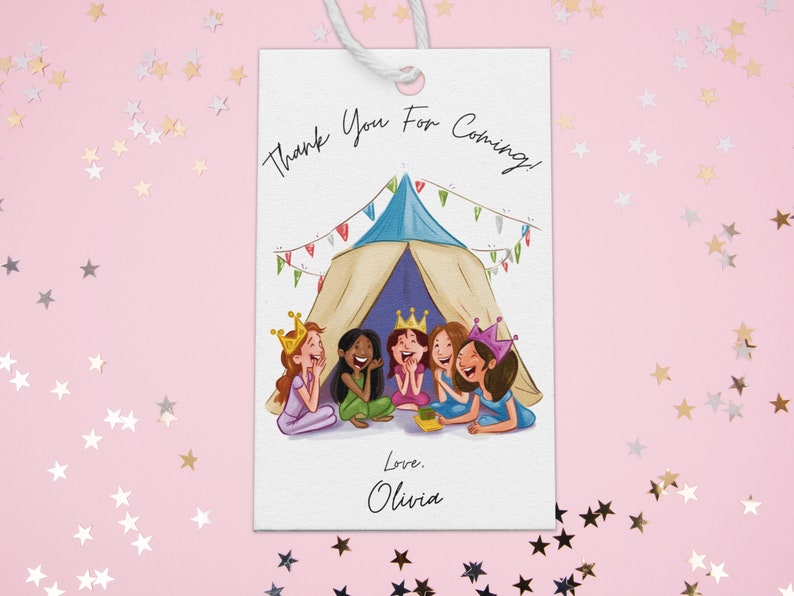 May include: A white thank you tag with a colorful illustration of five girls wearing crowns and sitting inside a tent. The text on the tag reads "Thank You For Coming! Love, Olivia."