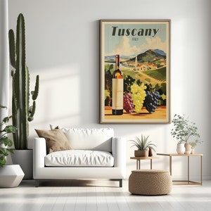 May include: Vintage travel poster featuring a bottle of wine and grapes with a scenic view of Tuscany, Italy. The poster has the text "Tuscany, Italy" at the top.