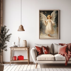 May include: A painting of an angel with white wings and a white dress. The angel is holding a sprig of holly in her hand. The painting is set against a background of stars.