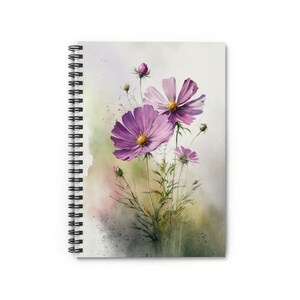 May include: Spiral-bound notebook featuring a watercolor painting of purple cosmos flowers with yellow centers. The floral design includes green stems and buds against a soft, blended background of pink, green, and white.