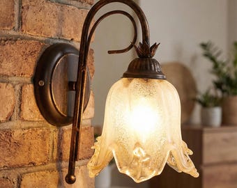 Classic 1-light wall sconce in wrought iron and glass, handcrafted by the Charlie collection.