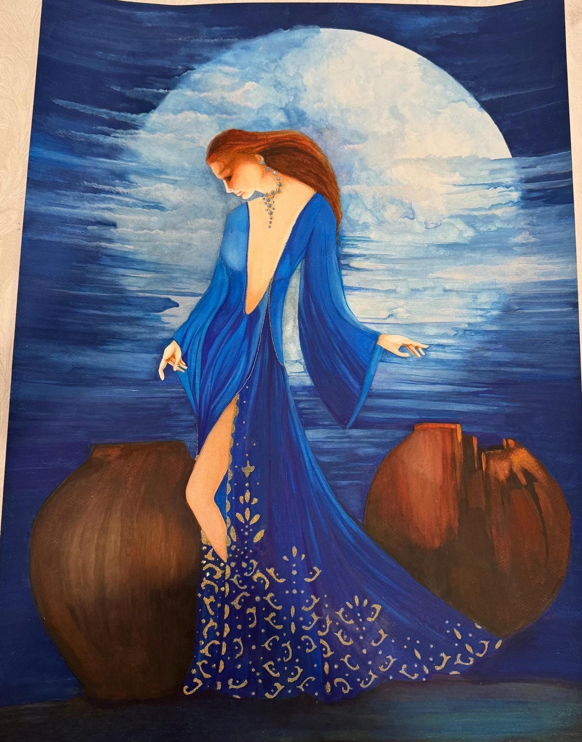 Moonlit Elegance: A Serene Woman in a Flowing Blue Gown Stands Under a ...