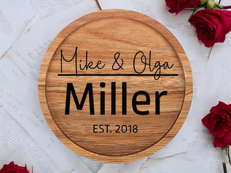 May include: A round wooden serving tray with the text "Mike & Olga Miller EST. 2018" engraved on it.