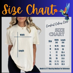 May include: Size chart for a t-shirt with measurements in inches. The chart shows the width and length of the shirt in sizes S, M, L, XL, 2XL, 3XL, and 4XL. The model is wearing a size M.