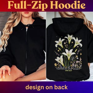 May include: Black full-zip hoodie with a front zipper closure. The back of the hoodie features a floral design with white lilies and the text "consider the lilies" from Luke 12:27. The top of the image reads "Full-Zip Hoodie".