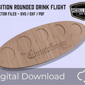 May include: A wooden drink flight with five rounded slots for tasting different beverages. The flight is engraved with the text "The Christoffersen Distillery" and numbered slots 1 through 5. The flight is a digital download file for CNC cutting.