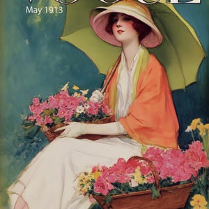 May include: Vogue magazine cover from May 1913. A woman in a white dress and orange shawl sits with two baskets of pink flowers. She holds a green parasol and wears a pink-brimmed hat. The magazine title is at the top.