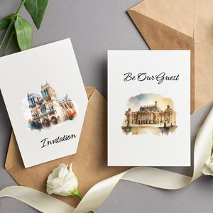 Peut inclure: Deux cartes blanches avec des illustrations &agrave; l'aquarelle de b&acirc;timents europ&eacute;ens c&eacute;l&egrave;bres. La carte de gauche pr&eacute;sente une illustration de la cath&eacute;drale Notre-Dame et le texte "Invitation". La carte de droite pr&eacute;sente une illustration du ch&acirc;teau de Versailles et le texte "Be Our Guest".