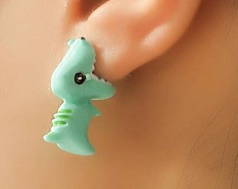 Dino biting earlobe earrings