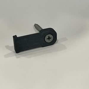 May include: A black plastic hook with a screw for attaching to a wall or other surface.