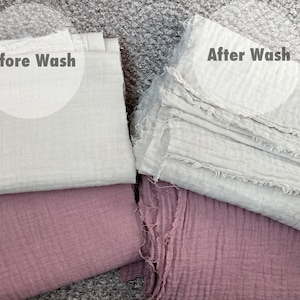 May include: Two pieces of fabric, one white and one pink, are shown before and after washing. The white fabric is folded and the pink fabric is unfolded. The text "Before Wash" and "After Wash" is written on the image.