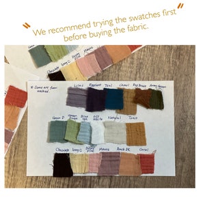 May include: A white card with fabric swatches in various colors, including green, blue, brown, red, and pink. The card has text that reads "We recommend trying the swatches first before buying the fabric." and "*Some are from washed."
