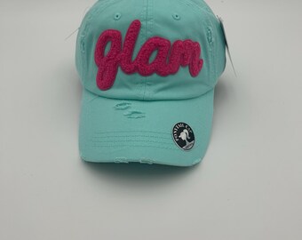 Cute Ponytail hat with a fluffy pink wording “ Glam”