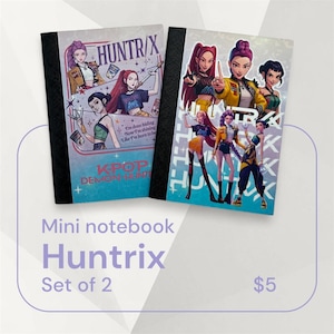 May include: Two mini notebooks with black spines and covers featuring colourful illustrations of anime-style characters. The notebooks have the text "HUNTR/X" and "KPOP DEMON HUNT". The notebooks are labelled "Mini notebook Huntrix Set of 2".