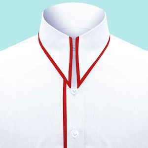 May include: A white dress shirt with a red trim around the collar and down the front.