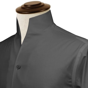 May include: A dark grey collared shirt with a mandarin collar and a single button fastening.