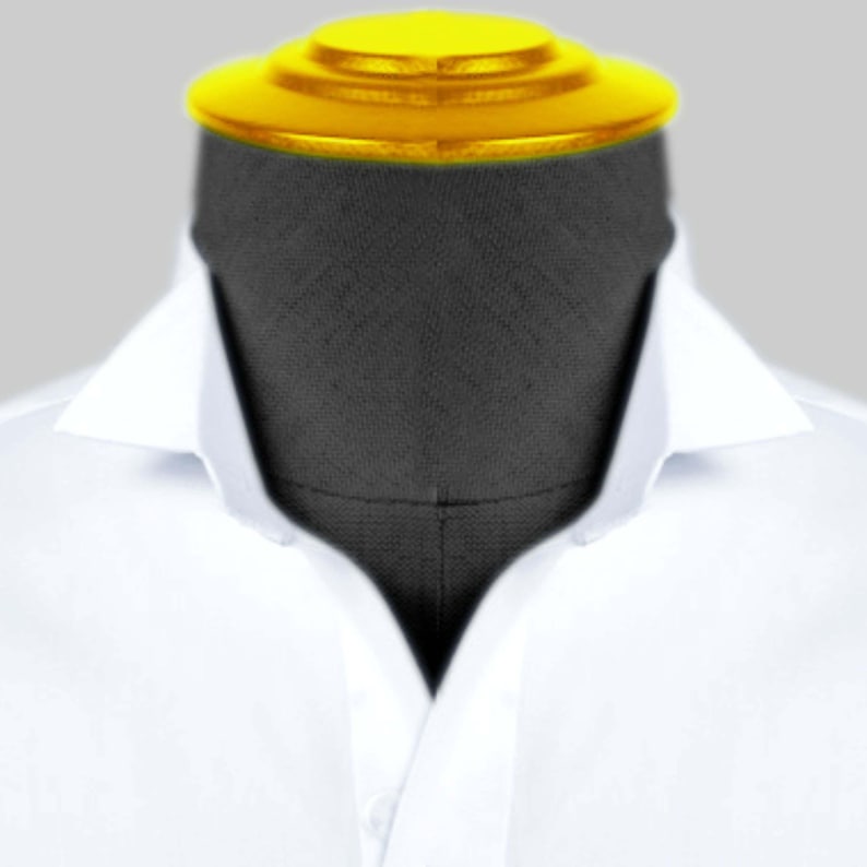 May include: A white dress shirt with a pointed collar. The shirt is on a mannequin with a black fabric head and a yellow top.