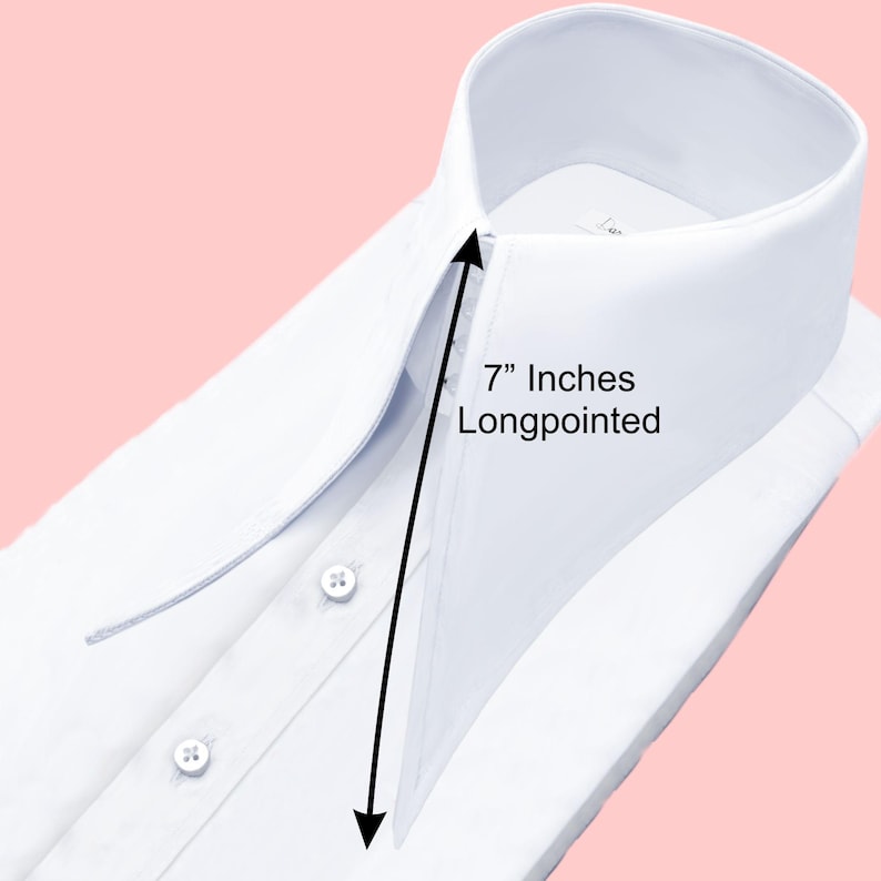 May include: Close-up of a crisp white dress shirt with a long-pointed collar. The collar measures 7 inches. The shirt has three visible buttons and is neatly folded. The background is a soft pink.