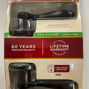 May include: A black Kwikset Signature Series door handle with a lifetime warranty and a 60-year trusted security guarantee. The handle is ANSI Grade 2 certified and features a guaranteed fit. The packaging also includes the text "Hall & Closet" and "Closet y Paso".
