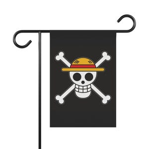 May include: Black garden flag featuring a white skull and crossbones design with a yellow and red straw hat. The flag is mounted on a black metal stand with a curved top.