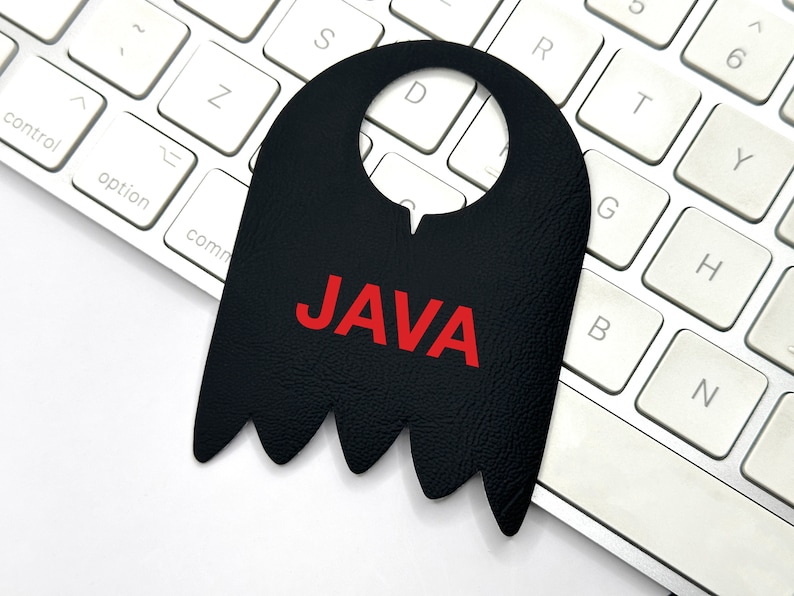 May include: A black leather door hanger with a cut-out for hanging and the word "JAVA" in red letters.