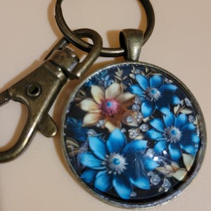 Blue Floral 30mm Glass Cabochon Bronze Keychain with split ring and lobster clasp.