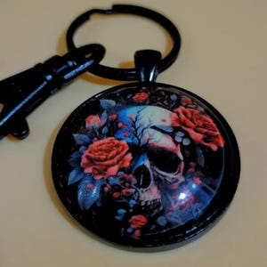 Skull and Roses 30mm Glass Cabochon Black Keychain with split ring and lobster clasp.