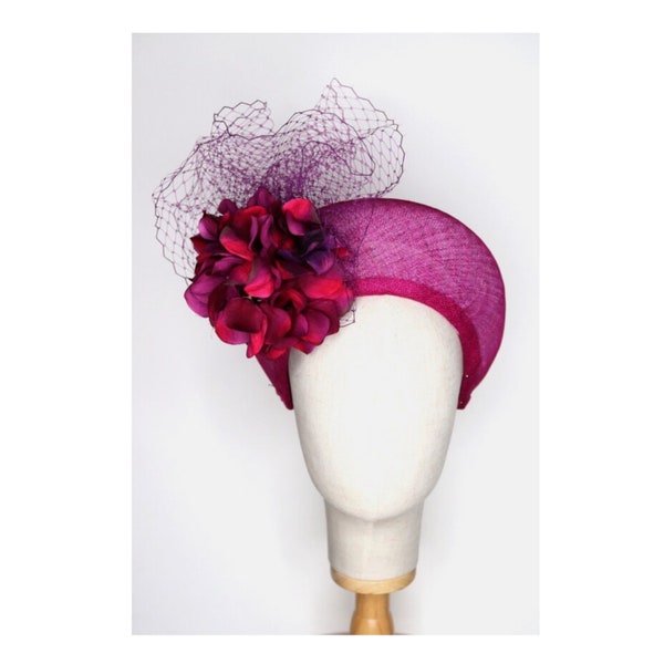 Fuschia Purple Pink Sinamay headpiece, with centre placed hydrangea flower wrapped in netting. Very comfortable to wear. Made to order. SOLD