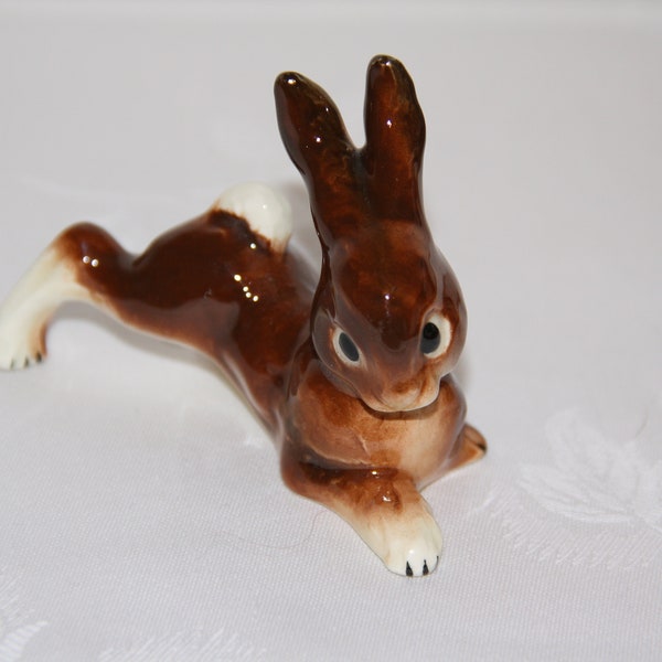 A porcelain rabbit figurine, marked for Goebel, West Germany on its base