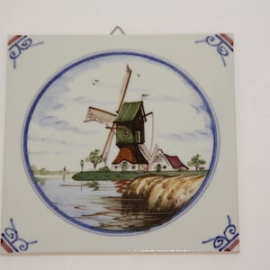Delft tile wall decoration with Dutch landscape with windmill