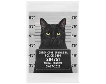 May include: A black cat with yellow eyes is centred in a mugshot-style graphic. The background features a height chart from 3'6" to 6'0". A sign held by the cat reads: GREEN COVE SPRINGS FL, POLICE DEPT, 284751, ANIMAL CONTROL, 09-27-2025.