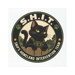 May include: A circular emblem featuring a black cat wearing a tactical vest, leaning over a wooden fence. The text S.H.I.T. and SNIP'S HOMELAND INTERVENTION TEAM is printed in a dark green border with two yellow stars and two paw prints.