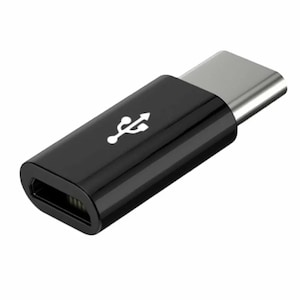 May include: Black USB-C to USB-A adapter. The adapter is small and rectangular with a USB-C connector on one end and a USB-A connector on the other end.
